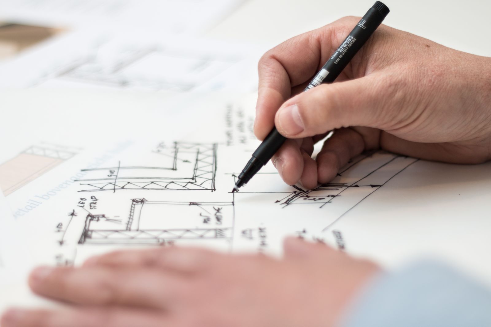 A hand drafting build plans