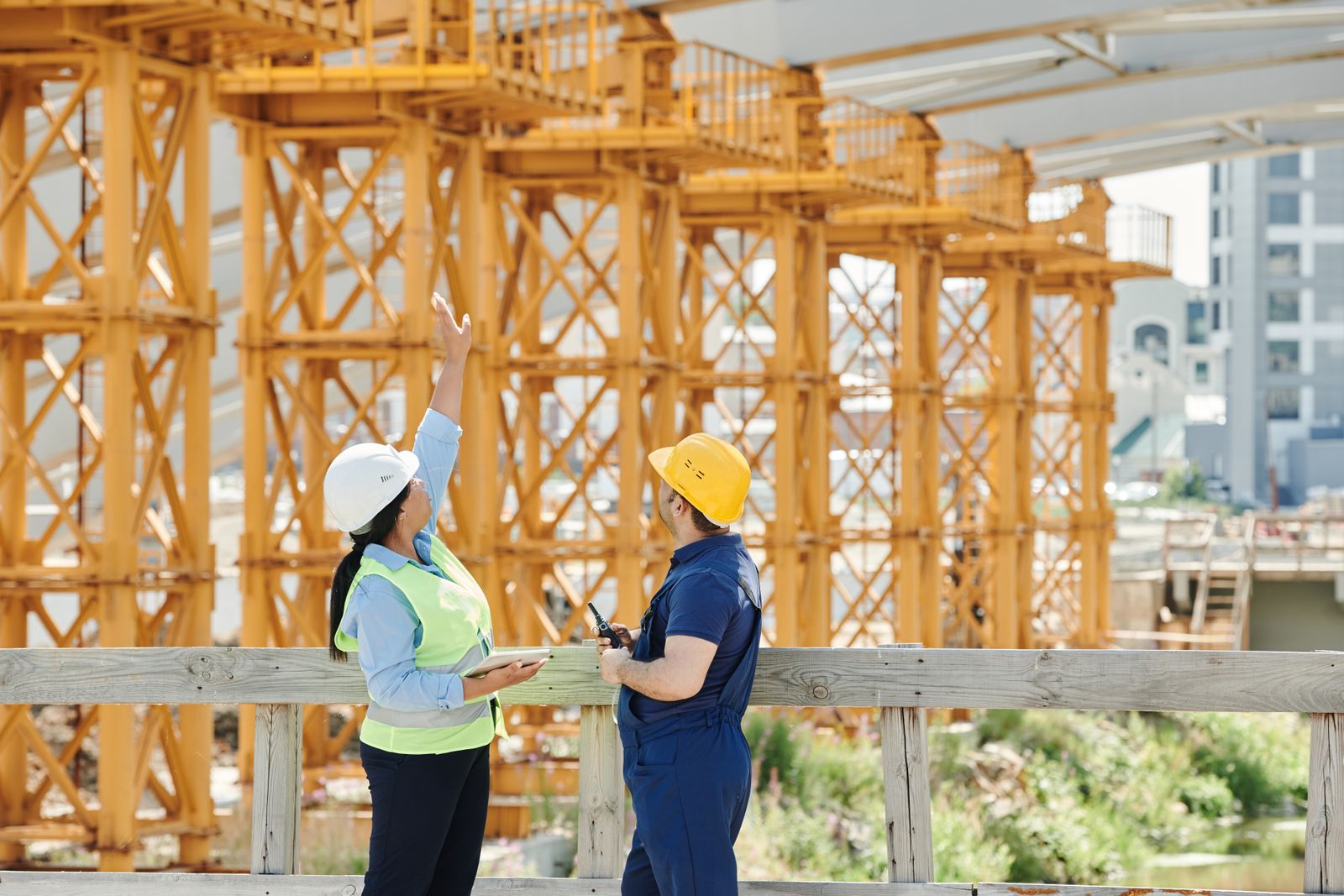 Crew members raising framing on a residential build