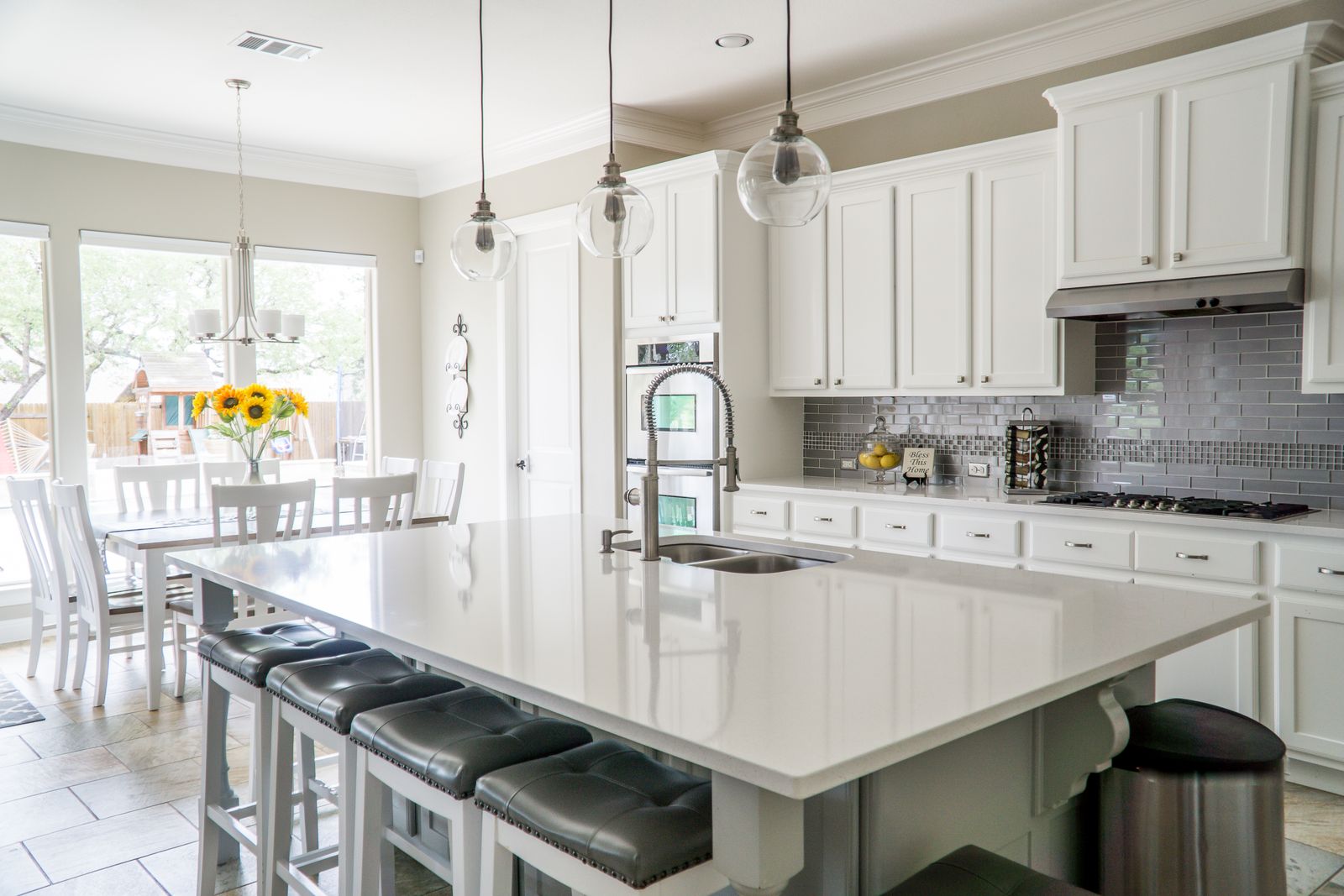 A bright remodeled kitchen with white cabinetry