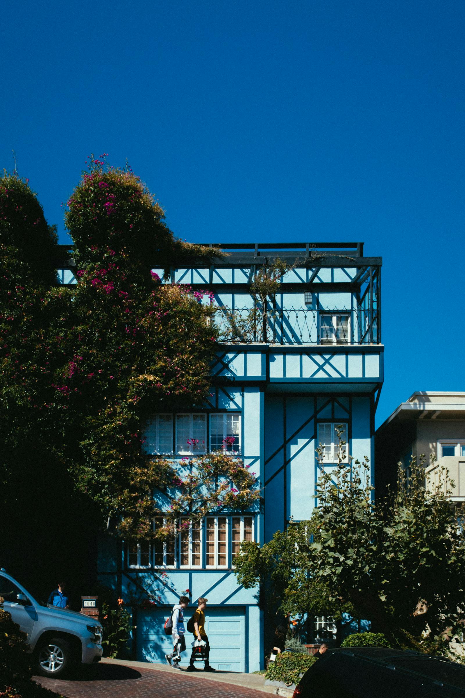 A modern custom home with dark siding and glass on a San Francisco lot