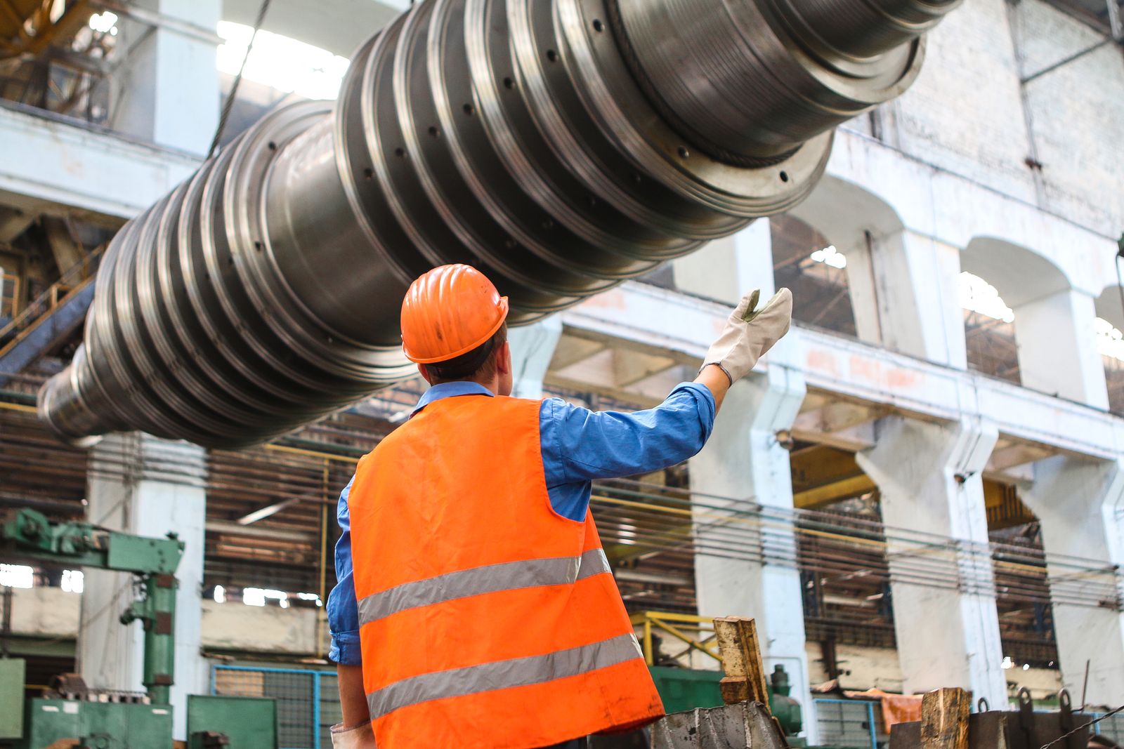 A crew member working from scaffolding